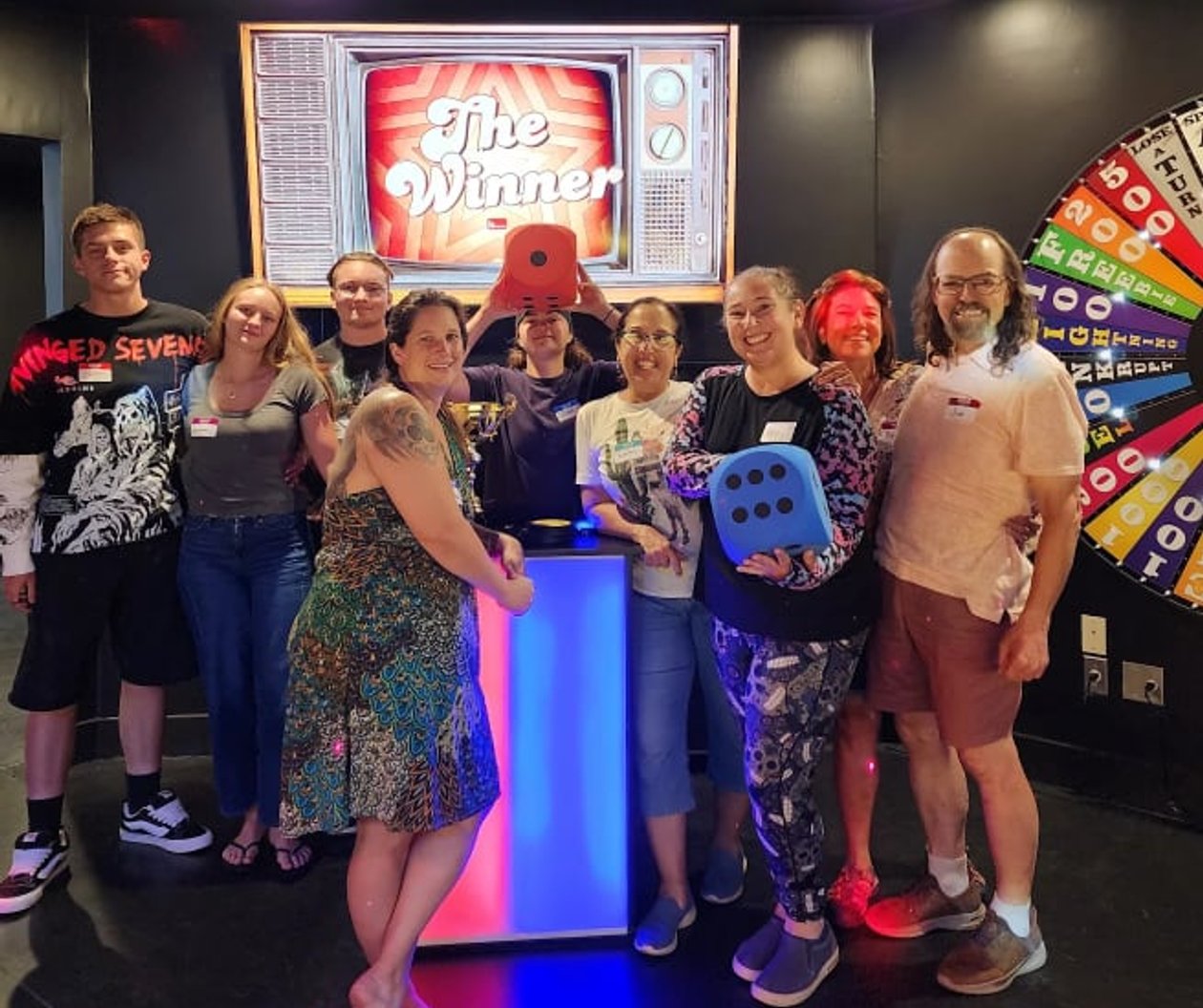 Team celebrating a win at ClueClock Gameshow in Castle Pines